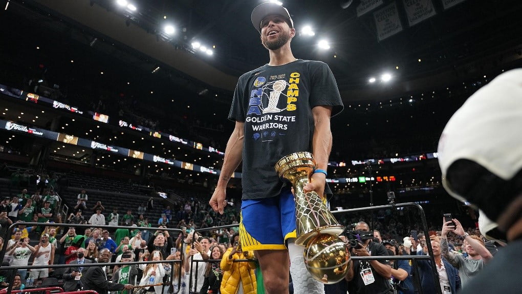 Stephen Curry of the Warriors holding Finals MVP trophy in Chase Center, San Francisco
